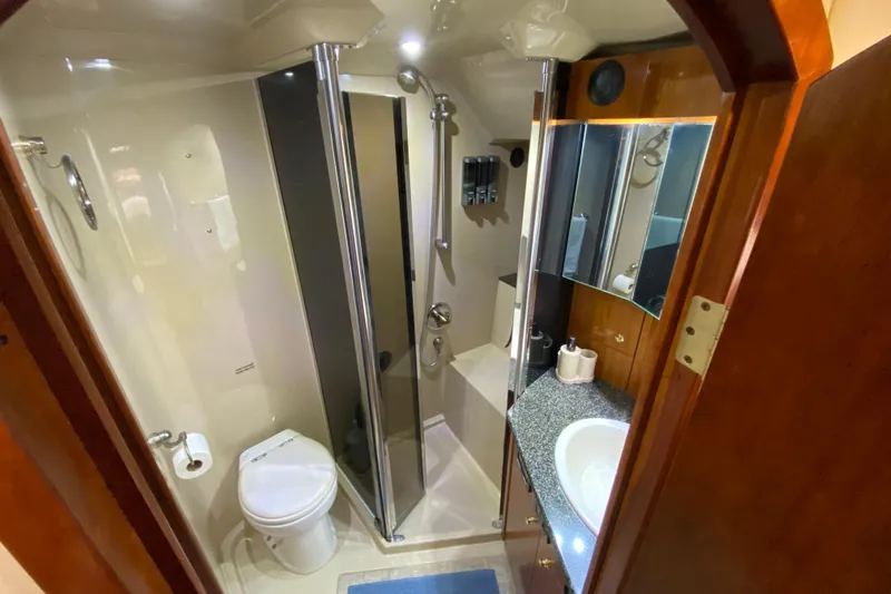  Yacht Photos Pics Luxurious bathroom in 2006 Cruisers Yachts 520 Express with shower and vanity.