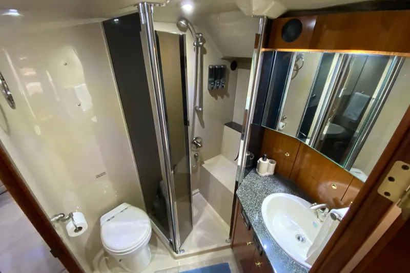  Yacht Photos Pics Luxurious bathroom in 2006 Cruisers Yachts 520 Express, featuring modern amenities and elegant design.