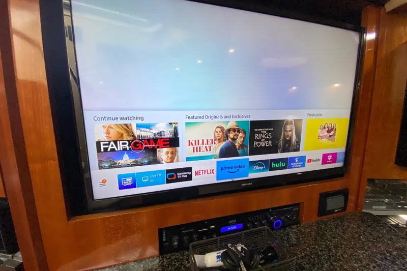  Yacht Photos Pics Flat-screen TV with streaming apps in a 2006 Cruisers Yachts 520 Express interior.