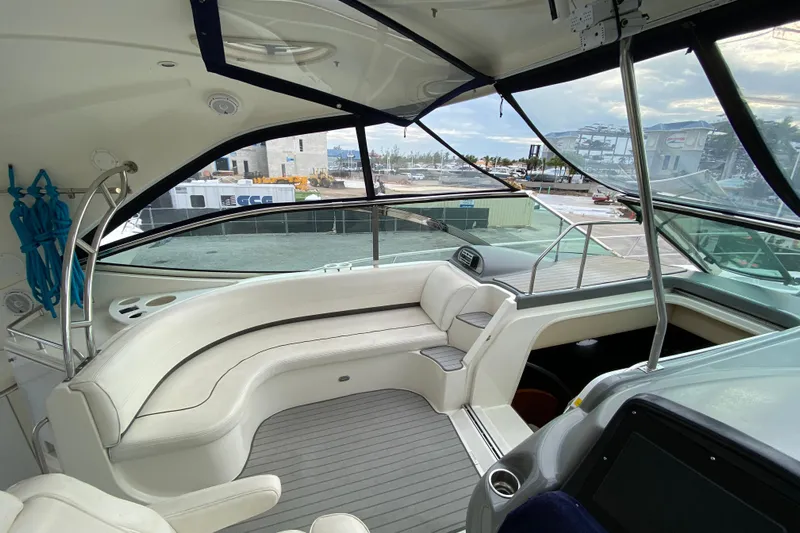  Yacht Photos Pics 2006 Cruisers Yachts 520 Express interior with white seating and panoramic windows.