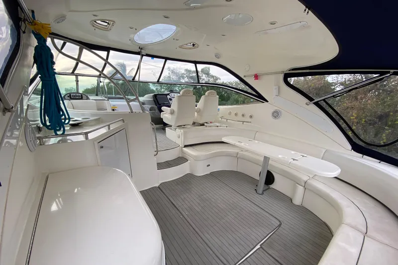  Yacht Photos Pics 2006 Cruisers Yachts 520 Express interior with seating, helm, and panoramic windows.