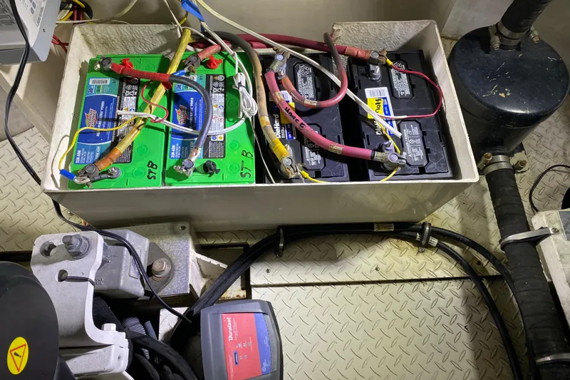  Yacht Photos Pics Battery compartment of a 2006 Cruisers Yachts 520 Express, showing wiring and connections.
