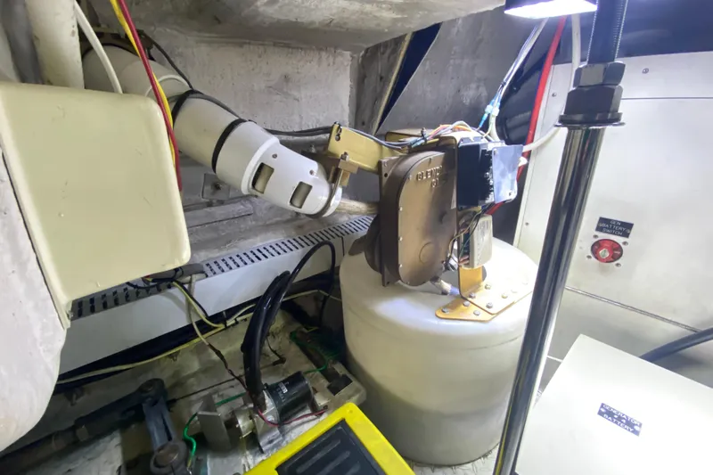  Yacht Photos Pics Engine room of 2006 Cruisers Yachts 520 Express with mechanical components and wiring.