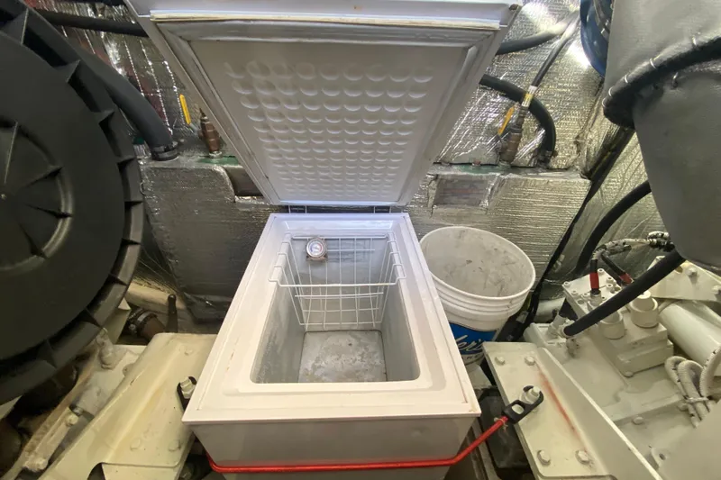  Yacht Photos Pics Open freezer in 2006 Cruisers Yachts 520 Express engine room, with surrounding equipment.