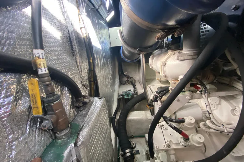  Yacht Photos Pics Engine room of 2006 Cruisers Yachts 520 Express, showcasing mechanical components and insulation.