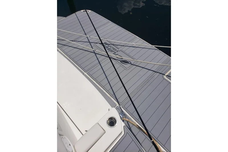  Yacht Photos Pics 2006 Cruisers Yachts 520 Express swim platform with ropes and water reflection.