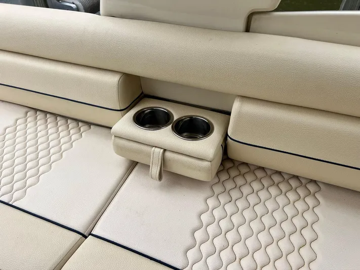  Yacht Photos Pics 2022 Chris-Craft Launch GT 28 Surf interior with beige leather seats and cup holders.