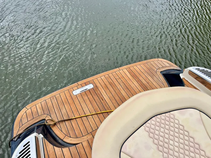  Yacht Photos Pics 2022 Chris-Craft Launch GT 28 Surf boat with wooden deck on water.