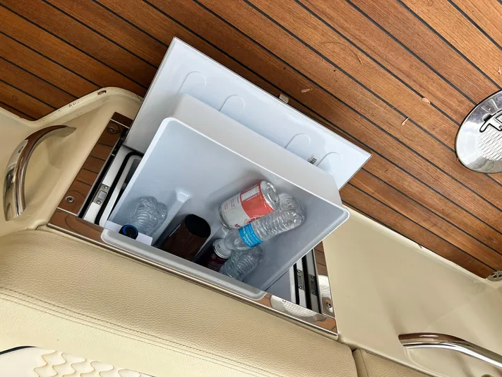  Yacht Photos Pics Built-in cooler with drinks on Chris-Craft Launch GT 28 Surf, 2022 model, teak deck.