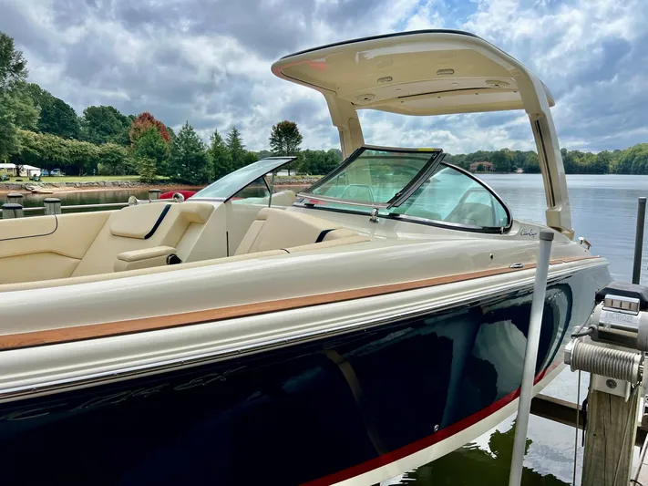  Yacht Photos Pics 2022 Chris-Craft Launch GT 28 Surf boat docked by a scenic lake.