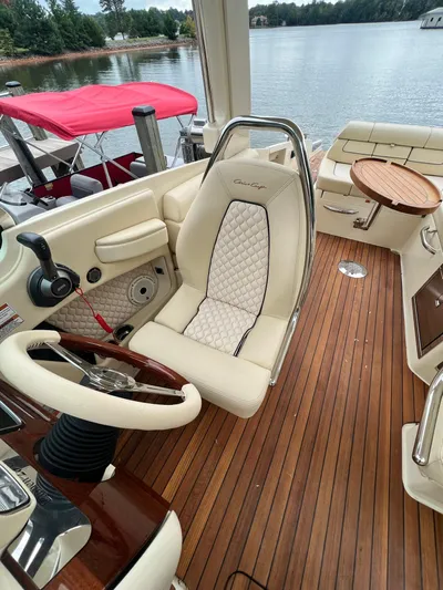  Yacht Photos Pics 2022 Chris-Craft Launch GT 28 Surf interior with luxurious seating and wooden deck.