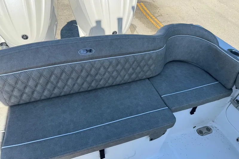  Yacht Photos Pics 2025 Sea Hunt Ultra 305 SE boat seating with gray upholstery and diamond stitching.