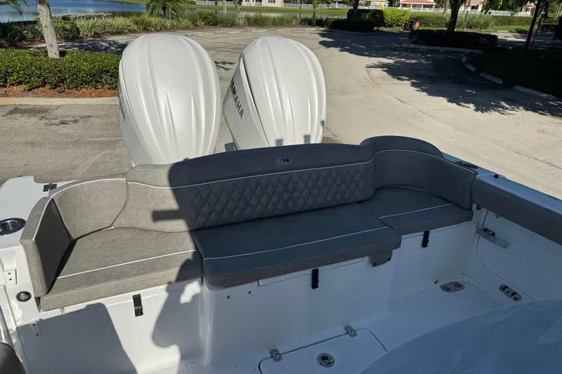  Yacht Photos Pics 2025 Sea Hunt Ultra 305 SE boat with dual Yamaha engines and cushioned seating.