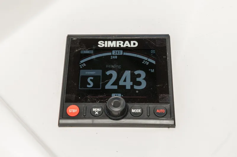 Un Dia Yacht Photos Pics Simrad navigation display showing heading 243 on a Post 43, 1984 model.