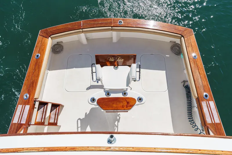 Un Dia Yacht Photos Pics Aerial view of 1984 Post 43 boat deck with wooden trim and fishing chair.