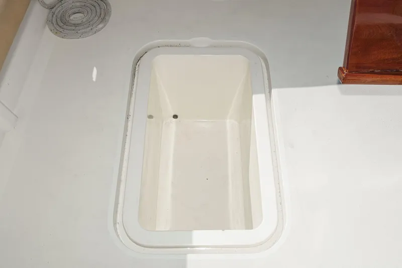 Un Dia Yacht Photos Pics Open storage compartment on a 1984 Post 43 boat deck.