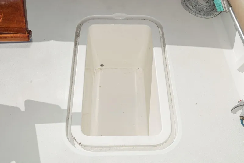 Un Dia Yacht Photos Pics Open storage compartment on 1984 Post 43 boat deck.