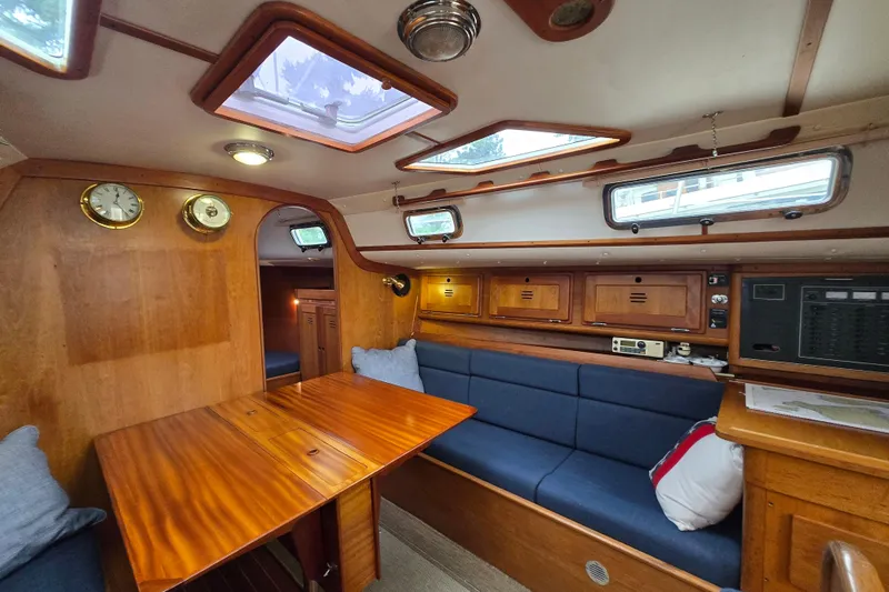 Orion Yacht Photos Pics Cozy 1997 Freedom 35 yacht interior with wooden finish and blue seating.