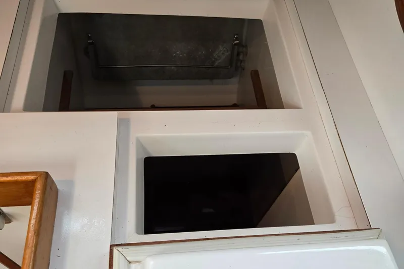 Orion Yacht Photos Pics Interior view of a 1997 Freedom 35 sailboat, featuring storage compartments.