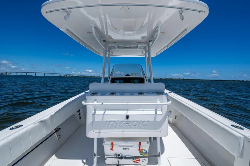  Yacht Photos Pics 2010 Intrepid 323 OPEN boat on water, clear sky, bridge in background.