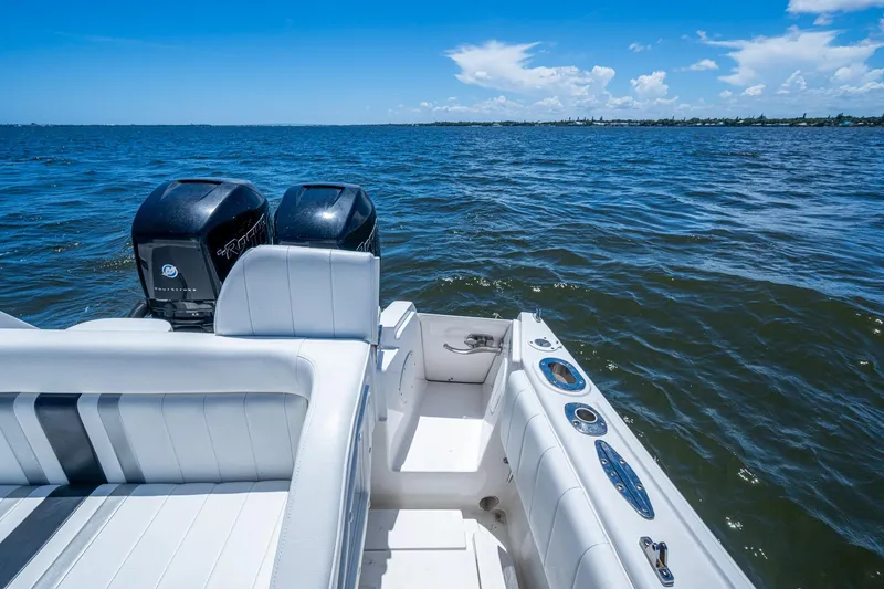  Yacht Photos Pics 2010 Intrepid 323 OPEN boat with dual engines on open water.