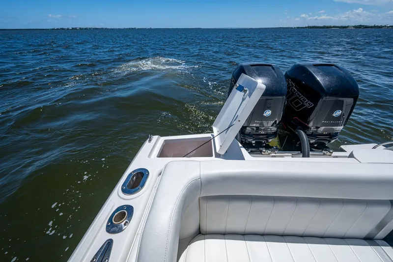  Yacht Photos Pics 2010 Intrepid 323 OPEN boat with dual outboard engines on open water.