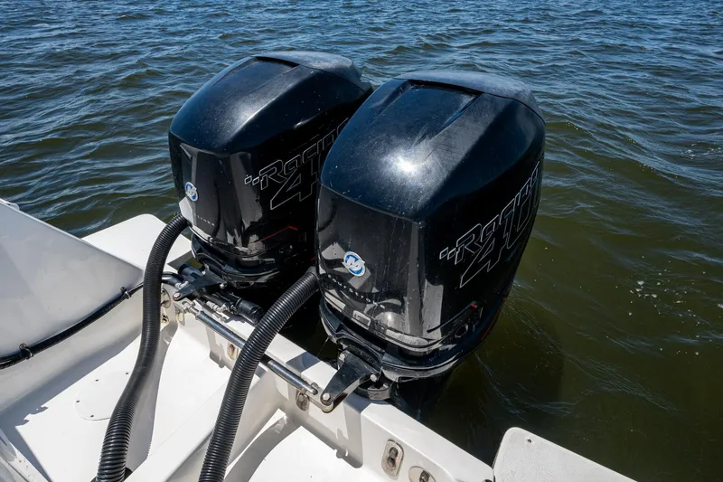  Yacht Photos Pics Twin outboard motors on a 2010 Intrepid 323 OPEN boat in water.