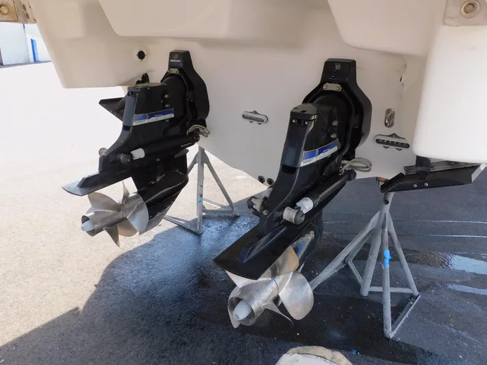 Tide Runner Yacht Photos Pics 2015 Formula Bowrider 290 boat propellers on stands, showcasing dual outboard motors.