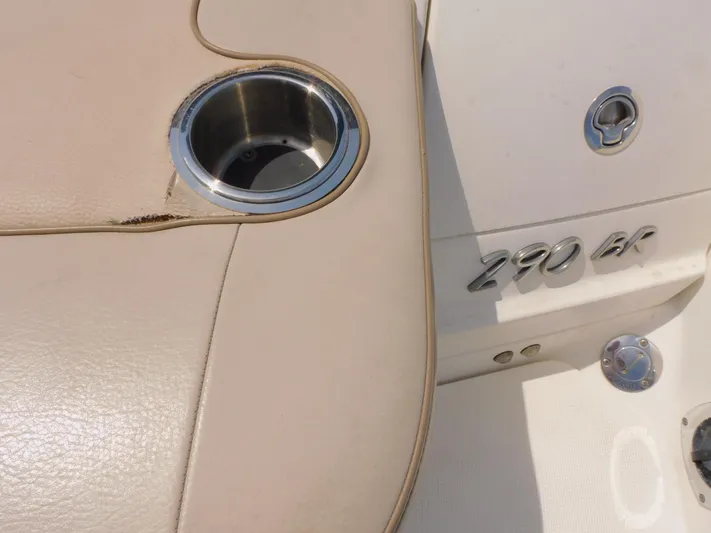 Tide Runner Yacht Photos Pics 2015 Formula Bowrider 290 interior with cup holder and model emblem.