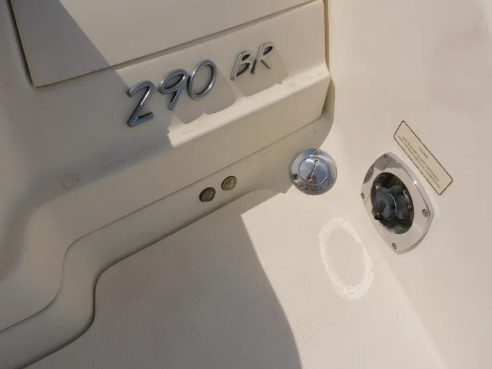 Tide Runner Yacht Photos Pics 2015 Formula Bowrider 290 boat detail showing model number and waste outlet.