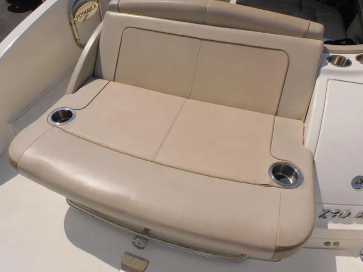 Tide Runner Yacht Photos Pics 2015 Formula Bowrider 290 boat seat with cup holders, beige upholstery.