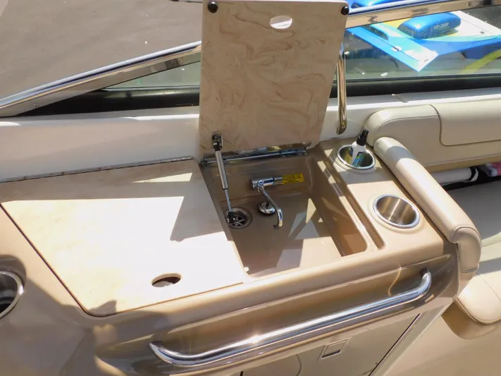Tide Runner Yacht Photos Pics 2015 Formula Bowrider 290 boat interior with sink and cup holders.