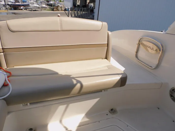 Tide Runner Yacht Photos Pics 2015 Formula Bowrider 290 boat interior with beige seating and branded handle.