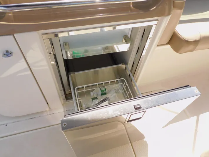 Tide Runner Yacht Photos Pics Open drawer refrigerator on 2015 Formula Bowrider 290 boat, showing interior storage.