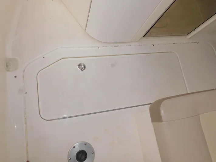 Tide Runner Yacht Photos Pics 2015 Formula Bowrider 290 interior detail, featuring storage compartment and seating area.