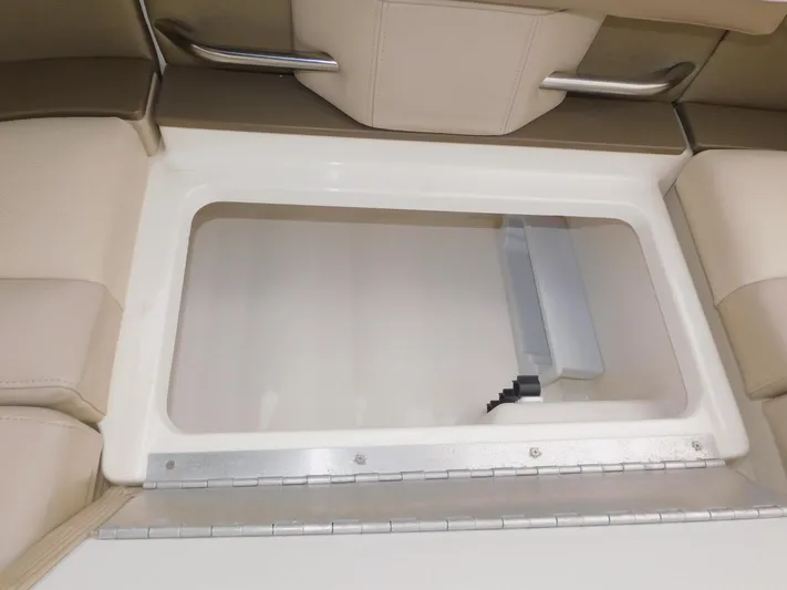 Tide Runner Yacht Photos Pics 2015 Formula Bowrider 290 storage compartment with beige seating and metal handles.
