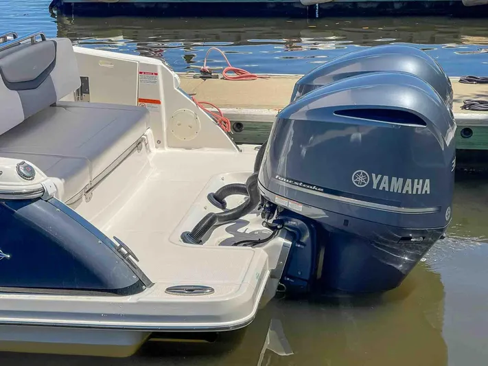  Yacht Photos Pics 2021 Chaparral 300 OSX boat with Yamaha outboard engines docked by the water.