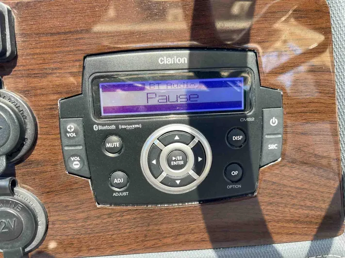  Yacht Photos Pics Clarion audio system on 2021 Chaparral 300 OSX, displaying "Pause" on screen.