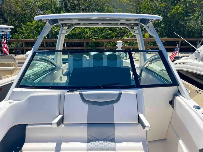  Yacht Photos Pics 2021 Chaparral 300 OSX boat with sleek design and spacious seating area.