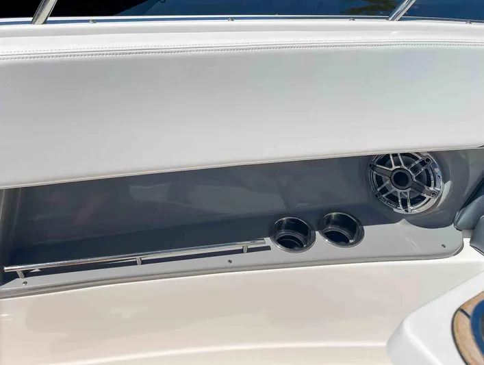  Yacht Photos Pics Interior detail of 2021 Chaparral 300 OSX boat with speaker and cup holders.