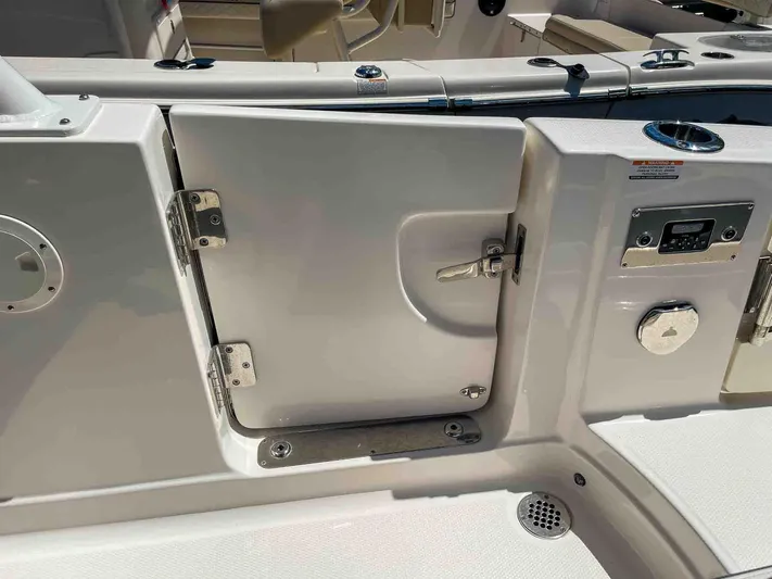  Yacht Photos Pics 2021 Chaparral 300 OSX boat deck with closed hatch and stainless steel hardware.