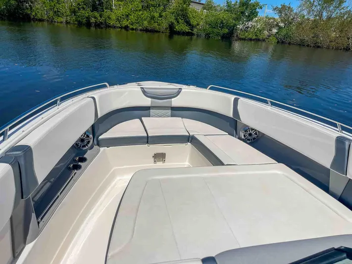  Yacht Photos Pics 2021 Chaparral 300 OSX boat interior with spacious seating on calm water.