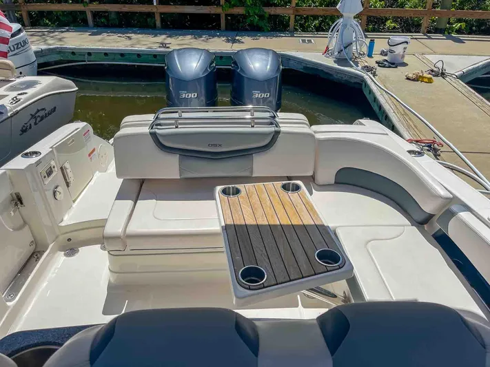  Yacht Photos Pics 2021 Chaparral 300 OSX boat with dual engines and seating area at the dock.