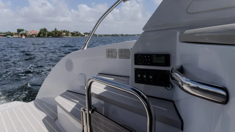  Yacht Photos Pics 2023 Azimut Atlantis 45 yacht deck with railing, control panel, and ocean view.