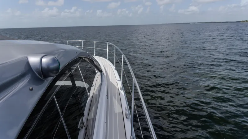  Yacht Photos Pics 2023 Azimut Atlantis 45 yacht cruising on open water under a clear sky.