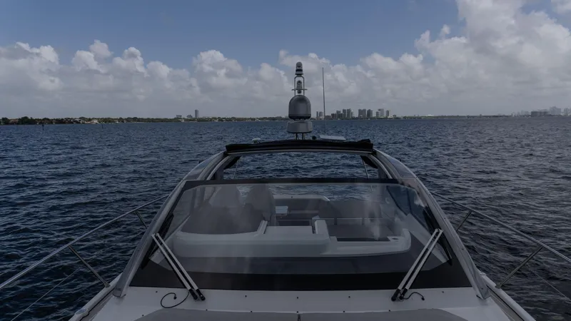  Yacht Photos Pics 2023 Azimut Atlantis 45 yacht cruising on open water under a cloudy sky.