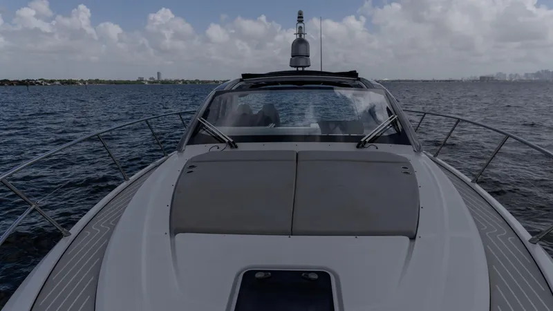  Yacht Photos Pics 2023 Azimut Atlantis 45 yacht cruising on open water under a cloudy sky.