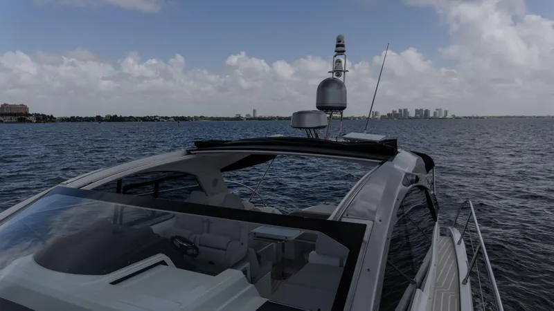  Yacht Photos Pics 2023 Azimut Atlantis 45 yacht cruising on open water under a cloudy sky.