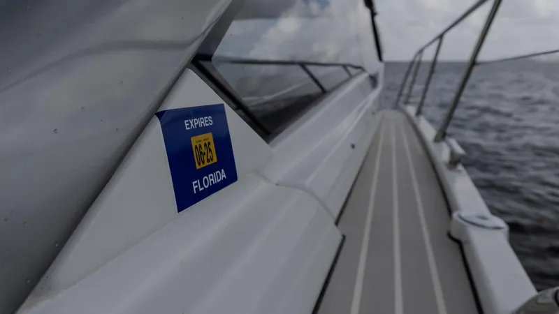  Yacht Photos Pics 2023 Azimut Atlantis 45 yacht with Florida registration sticker, cruising on open water.