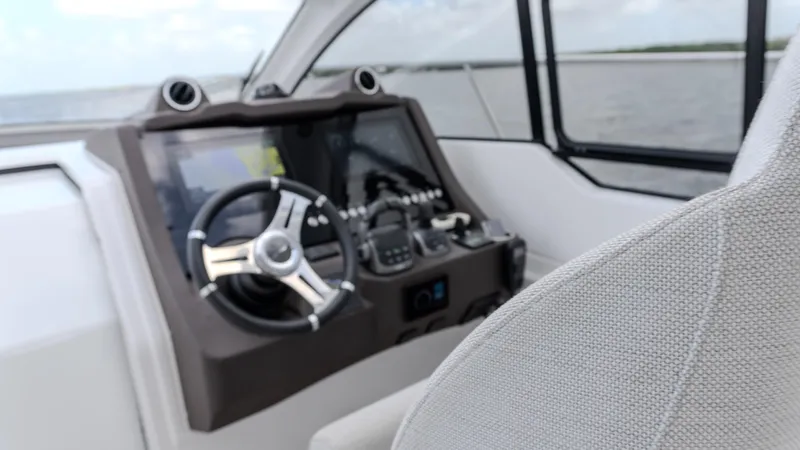  Yacht Photos Pics 2023 Azimut Atlantis 45 yacht helm with modern controls and steering wheel.